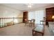 Open-plan living room with natural light and a loft-like view from the upper level at 542 Princeton Greens Ct # 21, Sun City Center, FL 33573