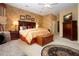 Main bedroom boasting a bed, nightstands, a chest of drawers, and an area rug at 542 Princeton Greens Ct # 21, Sun City Center, FL 33573