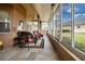 Enclosed patio features tile flooring, ceiling fans and lots of natural light at 542 Princeton Greens Ct # 21, Sun City Center, FL 33573