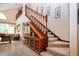 A multi-story staircase with carpeted steps and wooden banisters and built-in display cabinet at 542 Princeton Greens Ct # 21, Sun City Center, FL 33573