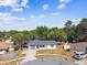 Aerial view showcases house with attached garage on corner lot with fenced yard at 5628 Mccoy Ct, Zephyrhills, FL 33542