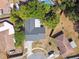 This beautiful property features a backyard pool and is surrounded by mature landscaping at 5628 Mccoy Ct, Zephyrhills, FL 33542