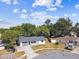 Aerial view highlights the house in a cul-de-sac with large front yard and attached garage at 5628 Mccoy Ct, Zephyrhills, FL 33542
