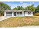 Charming single-story home with an attached one car garage and well-maintained lawn at 5628 Mccoy Ct, Zephyrhills, FL 33542