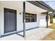 Close-up of the front door and window of the home's architecture at 5628 Mccoy Ct, Zephyrhills, FL 33542