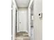Hallway with wood floors and doors leading to different rooms at 5628 Mccoy Ct, Zephyrhills, FL 33542