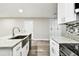 Updated kitchen showcases granite counters, a stainless sink, and modern cabinets at 5628 Mccoy Ct, Zephyrhills, FL 33542