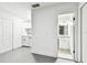 The laundry room features white cabinets, modern washer and dryer, and access to a full bathroom at 5628 Mccoy Ct, Zephyrhills, FL 33542