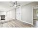 Living room features new flooring, white walls, recessed lights, and lots of natural light at 5628 Mccoy Ct, Zephyrhills, FL 33542