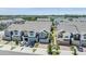 Wide aerial shot of townhomes with manicured lawns and modern amenities in a Gathering-friendly community at 5743 Skytop Dr, Lithia, FL 33547