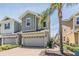 Charming two-story home featuring a brick driveway, attached garage, and pleasant landscaping at 5743 Skytop Dr, Lithia, FL 33547
