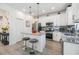Modern kitchen with stainless steel appliances, a center island with barstool seating at 5743 Skytop Dr, Lithia, FL 33547
