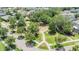 Aerial neighborhood view featuring mature trees and a small park with playground equipment at 5743 Skytop Dr, Lithia, FL 33547