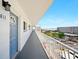 Condominium balcony with railing and a stunning view of the city at 5925 Shore S Blvd # 611, Gulfport, FL 33707