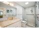 Accessible bathroom with marble vanity and glass-enclosed shower at 5925 Shore S Blvd # 611, Gulfport, FL 33707