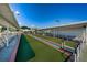 Outdoor bocce ball court with shaded seating area and green turf at 5925 Shore S Blvd # 611, Gulfport, FL 33707