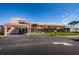 Exterior view of the community clubhouse with palm trees and well-maintained landscaping at 5925 Shore S Blvd # 611, Gulfport, FL 33707