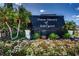Entrance sign for the community of Town Shores of Gulfport, with lush flowerbeds at 5925 Shore S Blvd # 611, Gulfport, FL 33707