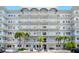 Stunning condominium exterior with multiple balconies and beautiful landscaping at 5925 Shore S Blvd # 611, Gulfport, FL 33707