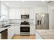 Modern kitchen with stainless steel appliances and ample storage at 5925 Shore S Blvd # 611, Gulfport, FL 33707