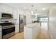 Lovely kitchen with stainless steel appliances, island, and open concept design at 5925 Shore S Blvd # 611, Gulfport, FL 33707