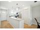 Bright kitchen with island, stainless steel appliances, and light wood floors at 5925 Shore S Blvd # 611, Gulfport, FL 33707