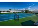 Outdoor tennis court with a blue and green surface, with building in the background at 5925 Shore S Blvd # 611, Gulfport, FL 33707