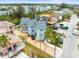 Aerial view of neighborhood featuring residential homes, palm trees, and construction site at 619 2Nd St # 3, Indian Rocks Beach, FL 33785