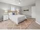 Well-lit bedroom featuring a ceiling fan, neutral walls, and a well-coordinated décor, creating a calm and relaxing space at 619 2Nd St # 3, Indian Rocks Beach, FL 33785