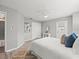 Bright bedroom featuring a ceiling fan, neutral walls, and a well-coordinated décor, creating a calm and relaxing space at 619 2Nd St # 3, Indian Rocks Beach, FL 33785