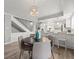Dining area flows into the updated kitchen, featuring modern appliances and breakfast bar at 619 2Nd St # 3, Indian Rocks Beach, FL 33785