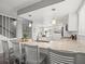 Bright, renovated kitchen featuring a large island, granite countertops and stainless steel appliances at 619 2Nd St # 3, Indian Rocks Beach, FL 33785