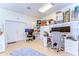 Spacious bonus room with two workstations, bonus storage and a calming paint color at 6612 N Orleans Ave, Tampa, FL 33604