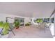 Expansive covered patio featuring stylish seating, creating an ideal outdoor living space at 6612 N Orleans Ave, Tampa, FL 33604
