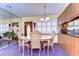 Cozy dining room featuring a table and chairs with a view of the entry at 6612 N Orleans Ave, Tampa, FL 33604