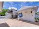 Detached garage with an open-air carport, a custom mural, and an attached utility sink area at 6612 N Orleans Ave, Tampa, FL 33604