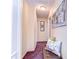 Hallway with decorative bench and pictures on the wall at 6612 N Orleans Ave, Tampa, FL 33604