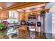 Charming kitchen showcasing wood cabinets, granite counters, stainless steel appliances and tile backsplash at 6612 N Orleans Ave, Tampa, FL 33604