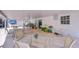 Spacious covered patio featuring stylish outdoor furniture, a ceiling fan, and a custom mural at 6612 N Orleans Ave, Tampa, FL 33604