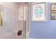 Shower stall features a glass door and decorative glass window at 6612 N Orleans Ave, Tampa, FL 33604