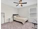 Neutral bedroom with a bed, ceiling fan, and bright window at 7721 Twin Leaf Ter, Parrish, FL 34219