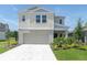 Charming exterior of a two story home with a concrete driveway and green grass at 7721 Twin Leaf Ter, Parrish, FL 34219