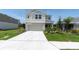 Inviting two-story home with an attached two car garage and manicured landscaping at 7721 Twin Leaf Ter, Parrish, FL 34219