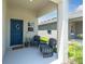 Inviting front porch with seating area, offering a relaxing outdoor space at 7721 Twin Leaf Ter, Parrish, FL 34219