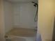 Bathroom area offering a shower and soaking tub combination with molded shelving at 8255 Richmond St, Gibsonton, FL 33534