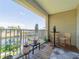 Cozy condo balcony with outdoor seating area overlooking a serene canal at 8304 Aquila St, Port Richey, FL 34668