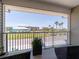 Private balcony with green view and patio furniture at 8304 Aquila St, Port Richey, FL 34668
