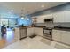 Clean kitchen featuring granite countertops and stainless steel appliances at 8304 Aquila St, Port Richey, FL 34668