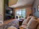 Modern living room with fireplace, access to balcony, comfortable seating and stylish decor at 8304 Aquila St, Port Richey, FL 34668