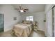 Cozy bedroom featuring vaulted ceilings, neutral decor, and wood-look tile flooring at 8635 Boca Ciega Dr, St Pete Beach, FL 33706